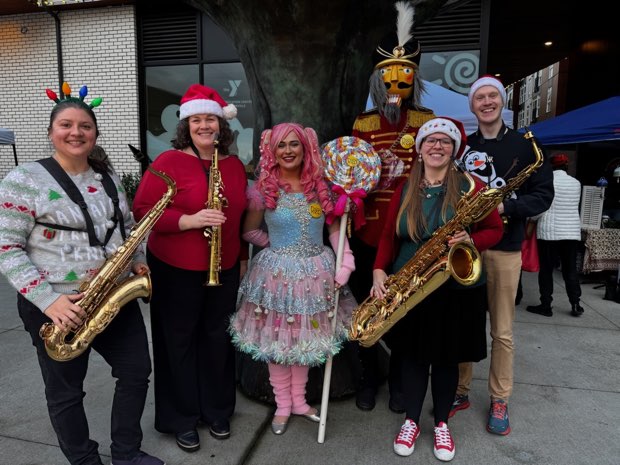 The group in holiday clothes at an outdoor winter event